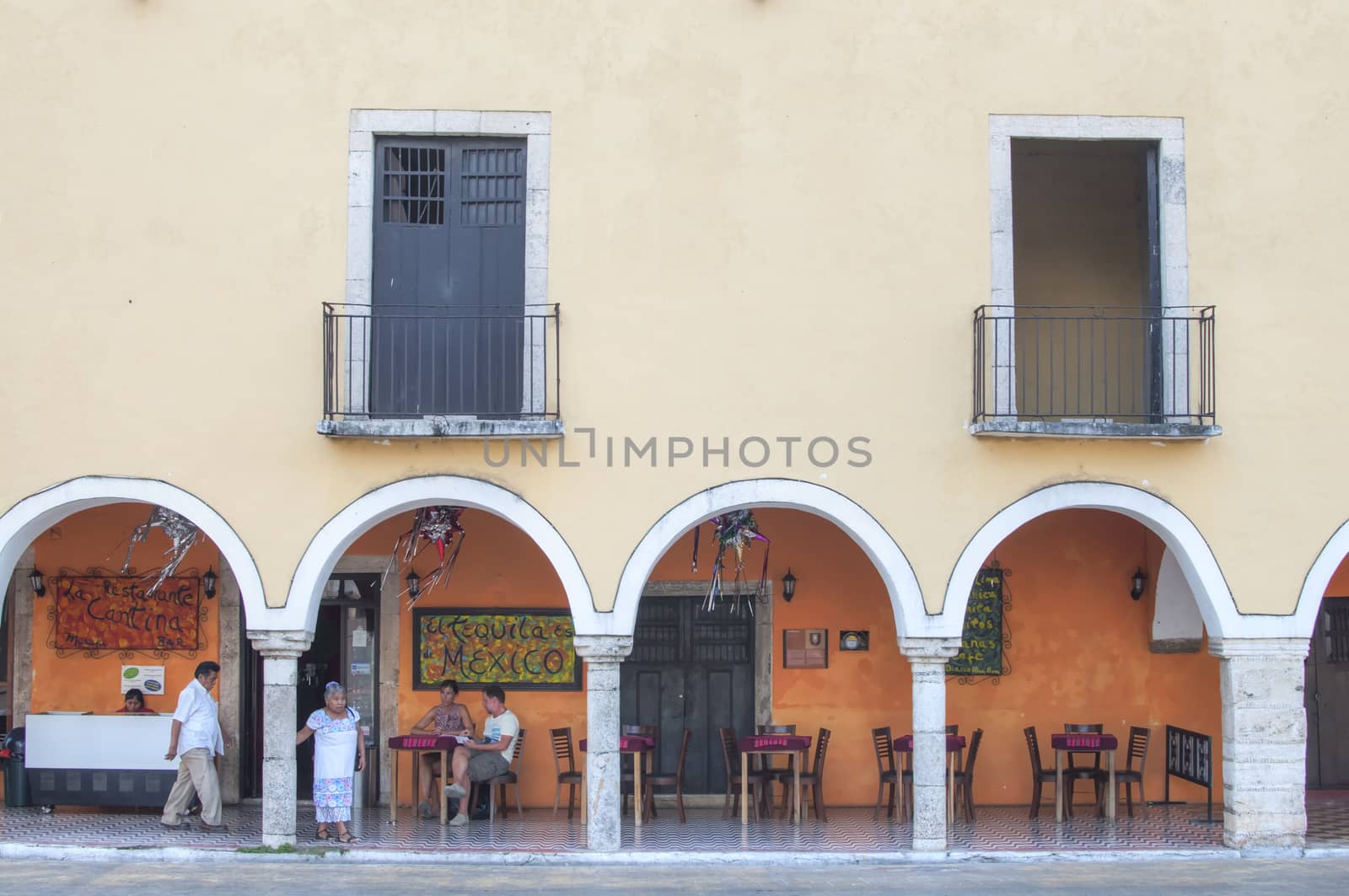 VALLADOLID, MEXICO - JANUARY 20, 2015: Columns and arches form the patio of La Cantina restaurant in Valladolid, Mexico, a colonial style restaurant in the center of the town