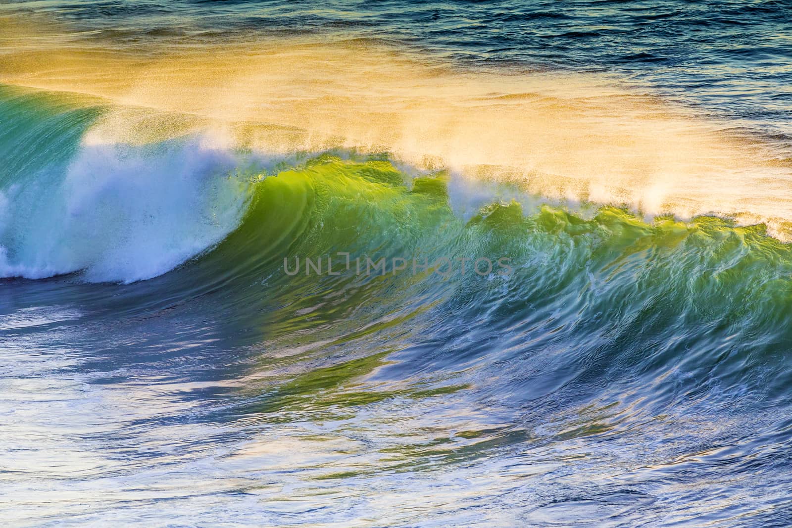 Texture of Ocean wave at sunset time.