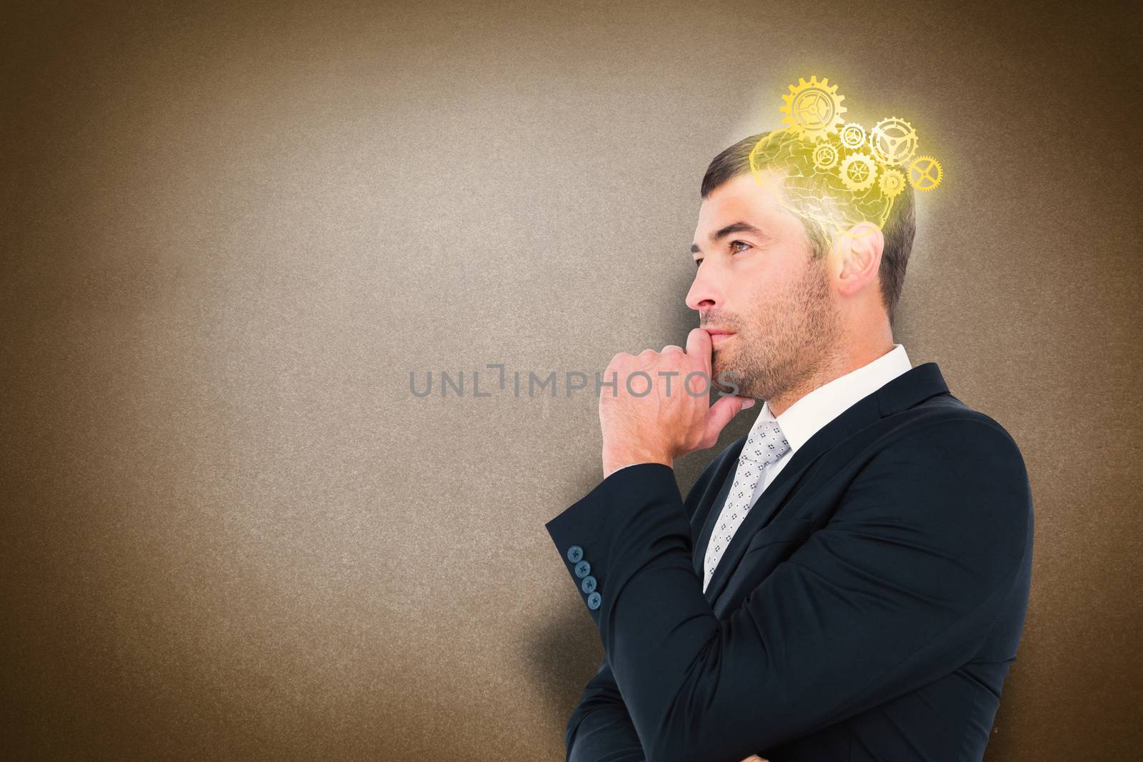 Composite image of frowning businessman thinking  by Wavebreakmedia