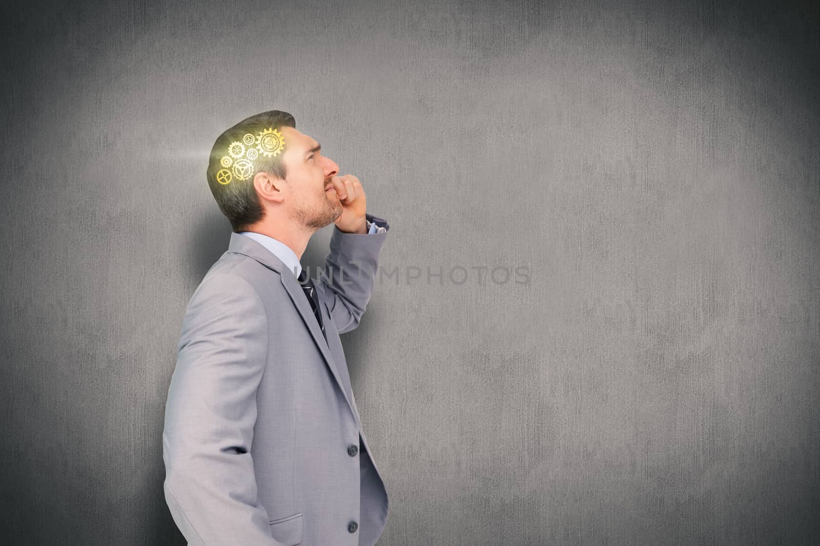 Thinking businessman against white and grey background