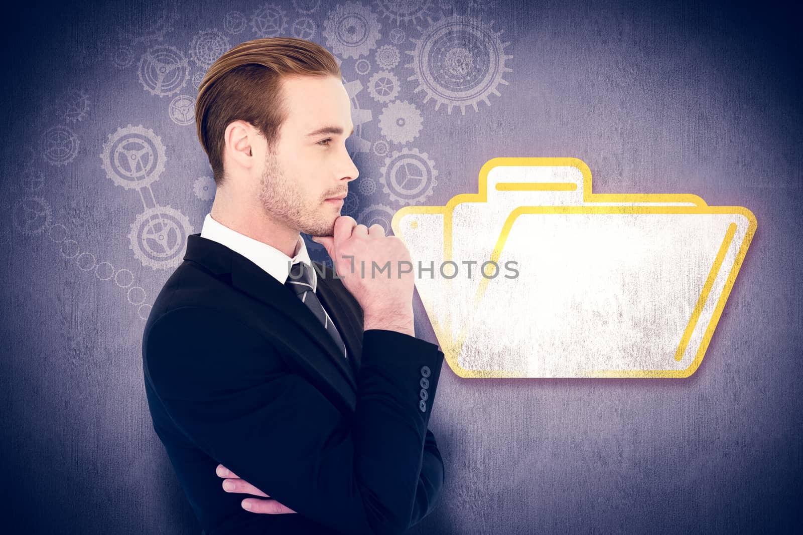 Thinking businessman standing with hand on chin against white and grey background