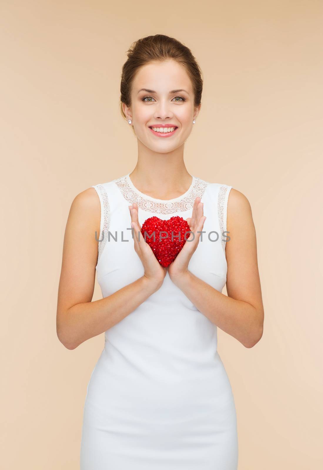 smiling woman in white dress with red heart by dolgachov