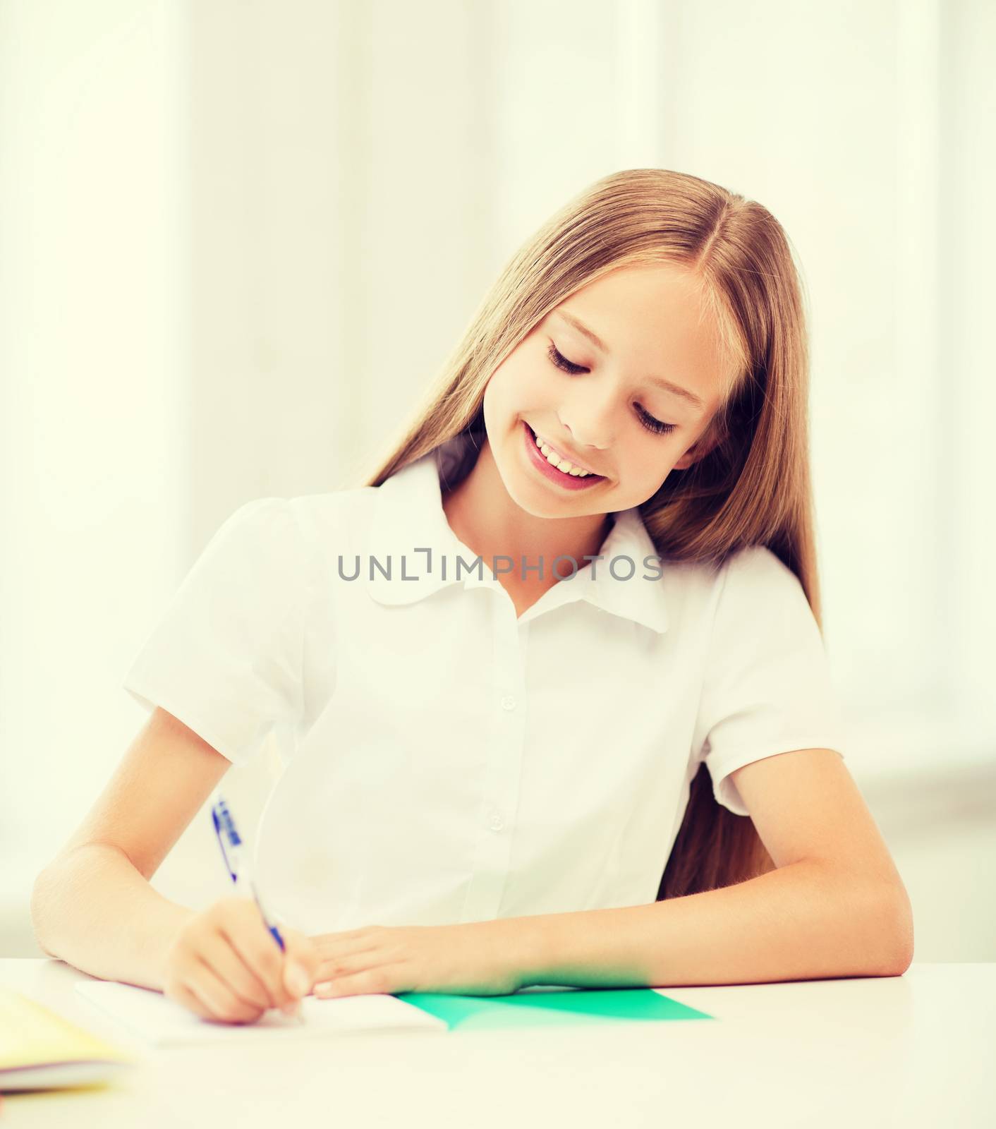 student girl studying at school by dolgachov