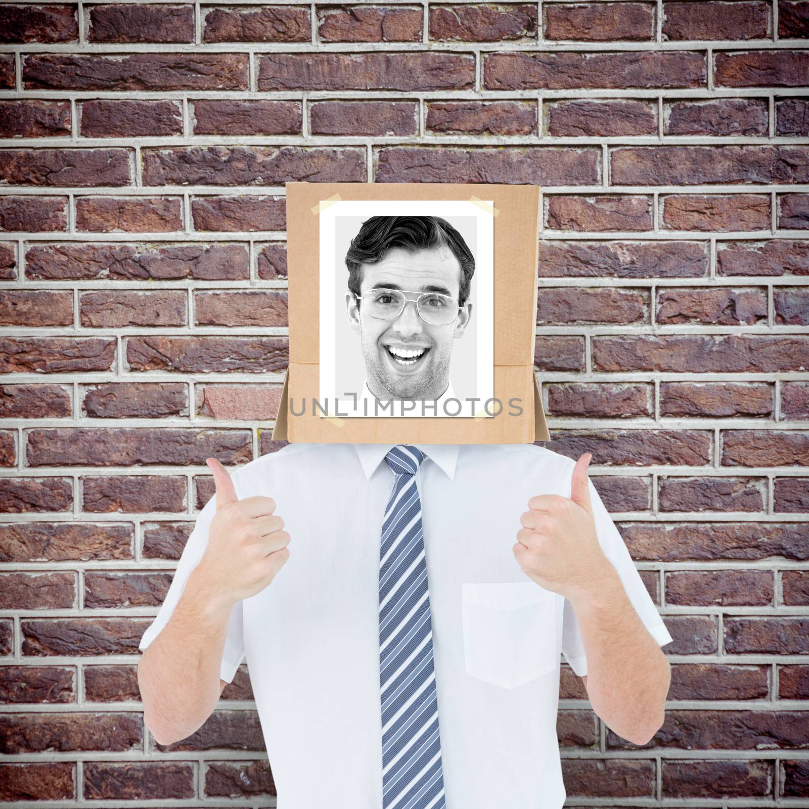 Composite image of businessman with photo box on head by Wavebreakmedia
