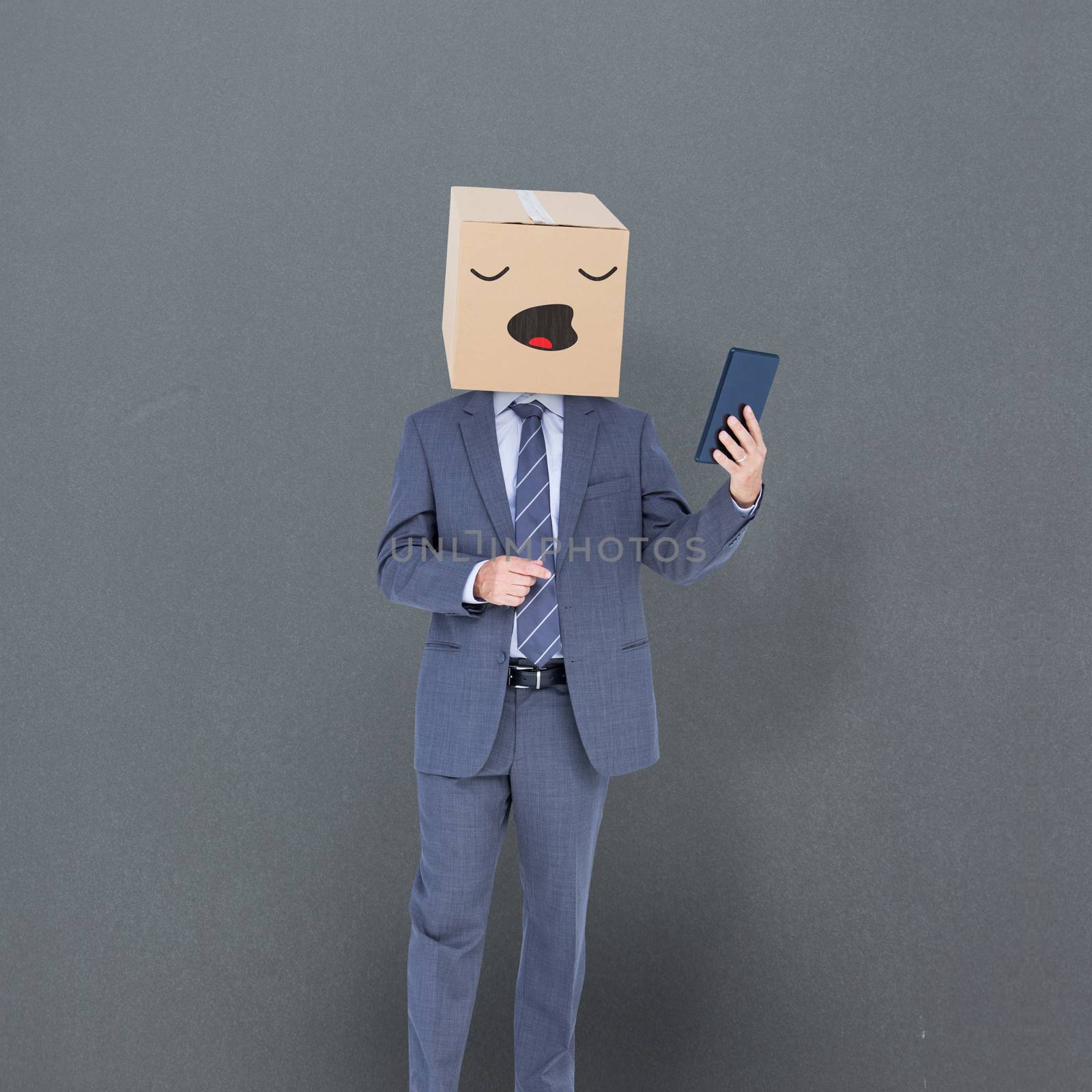 Anonymous businessman against grey background