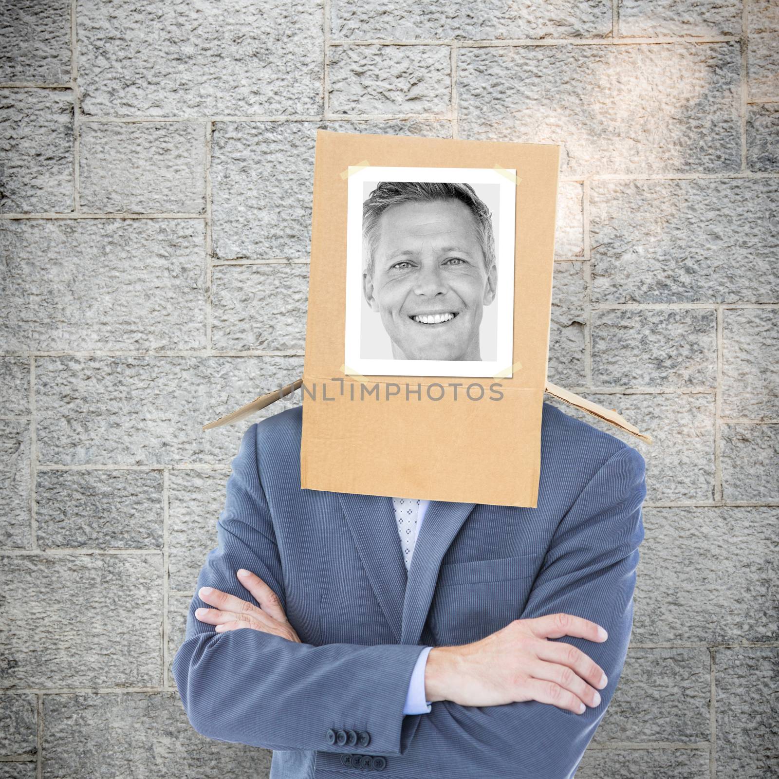 Composite image of businessman with photo box on head by Wavebreakmedia