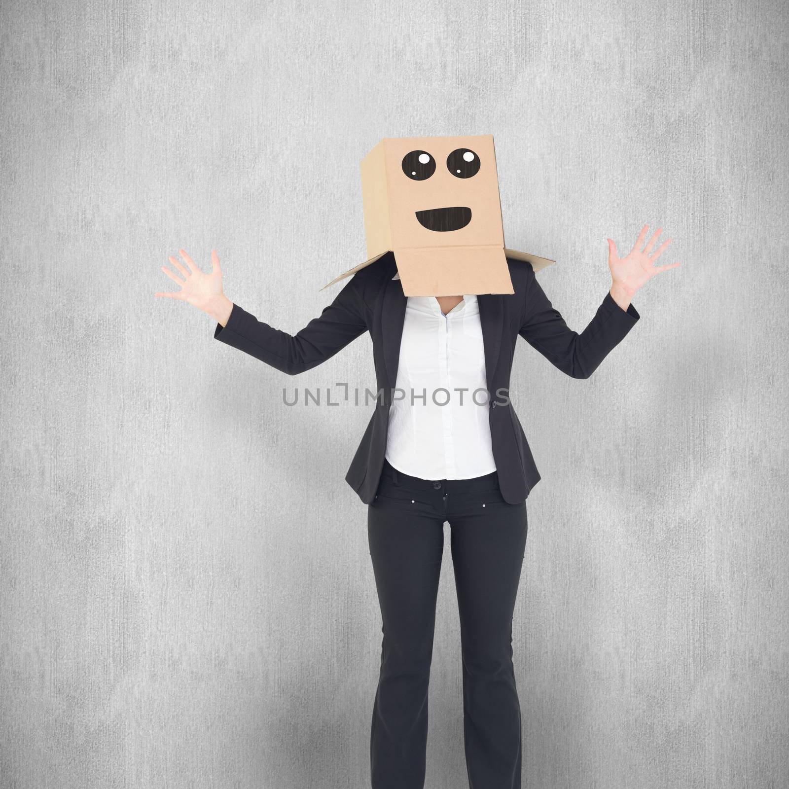 Businesswoman with box over head against white background