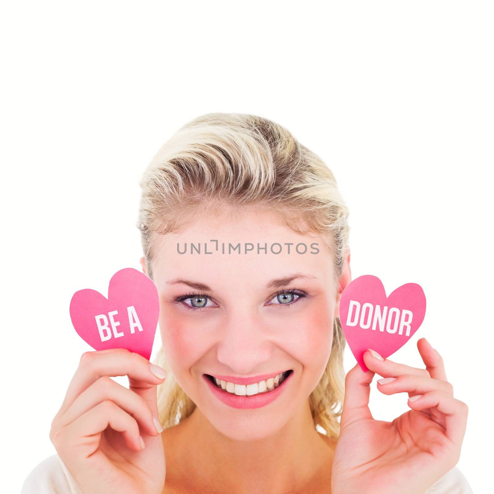 Composite image of attractive young blonde holding little hearts  by Wavebreakmedia