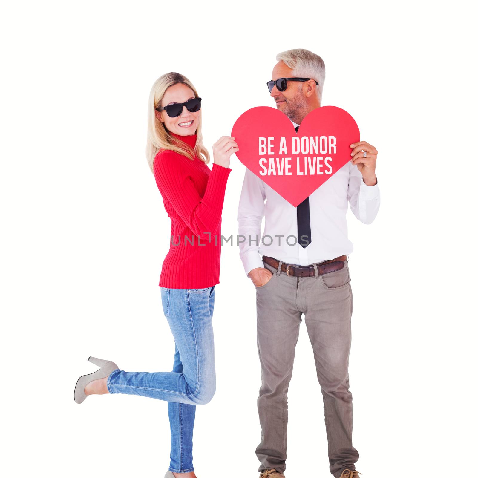 Cool couple holding a red heart together against be a donor save lives