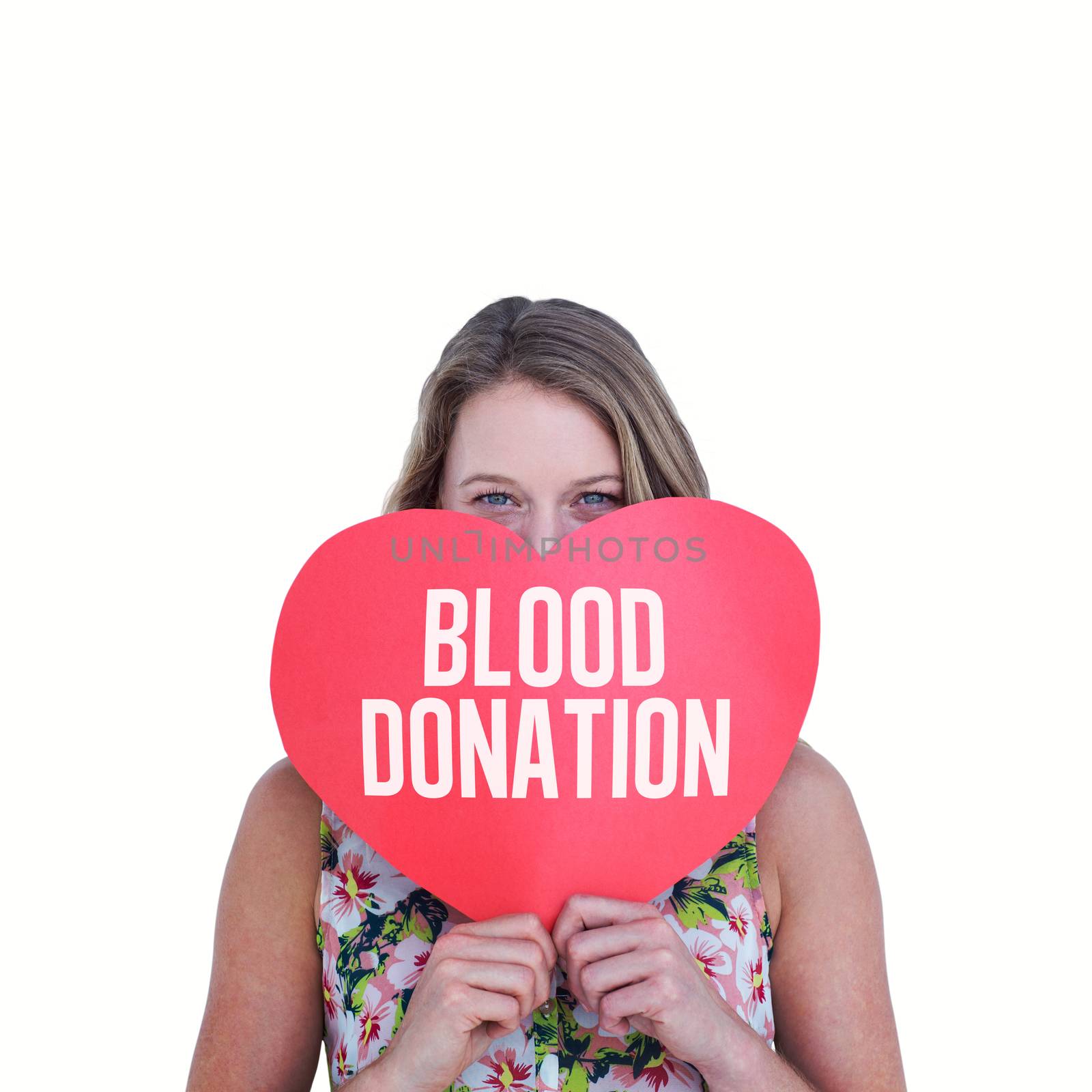 Woman holding heart card  against blood donation