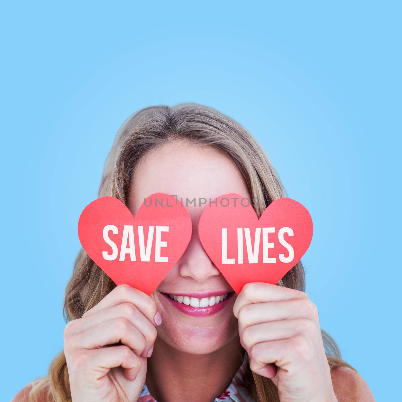 Woman holding heart cards  against blue vignette background