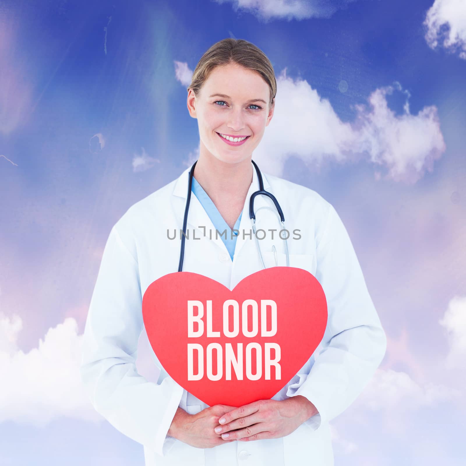 Composite image of doctor holding red heart card  by Wavebreakmedia