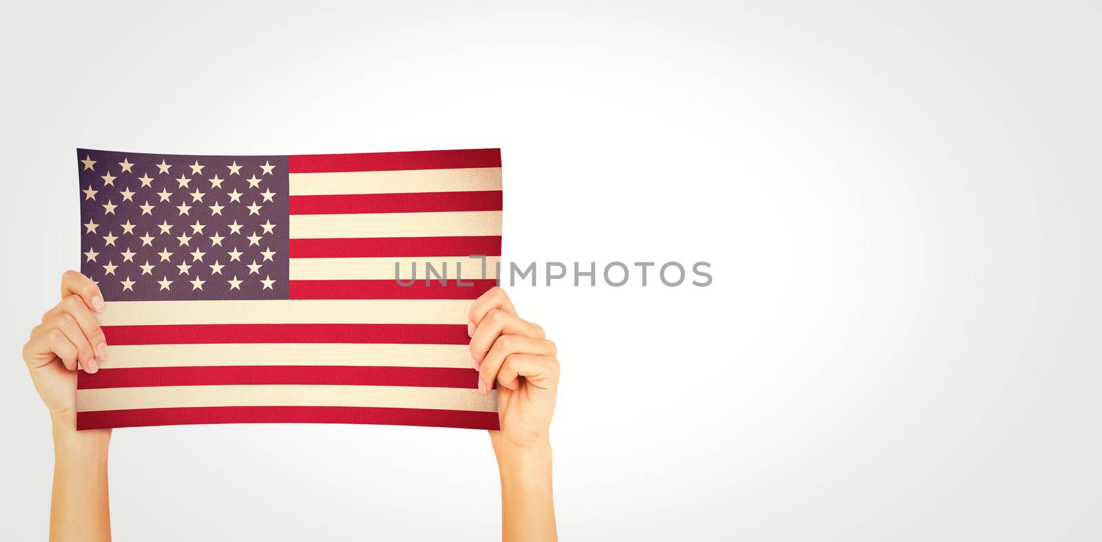 Hand showing card against usa national flag