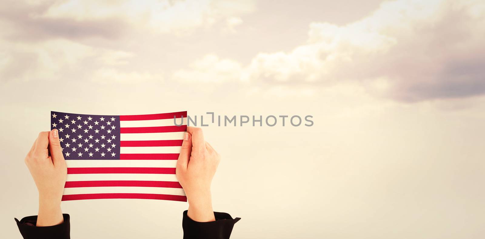 Hands showing against blue sky