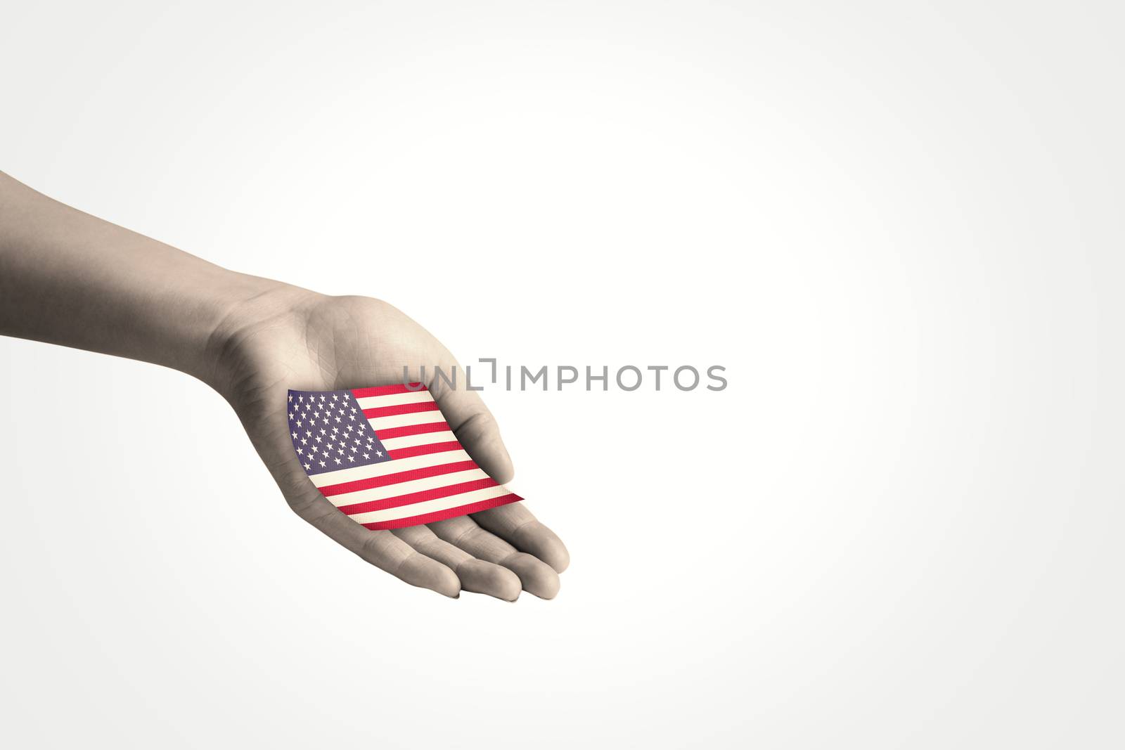 Hand presenting against usa national flag