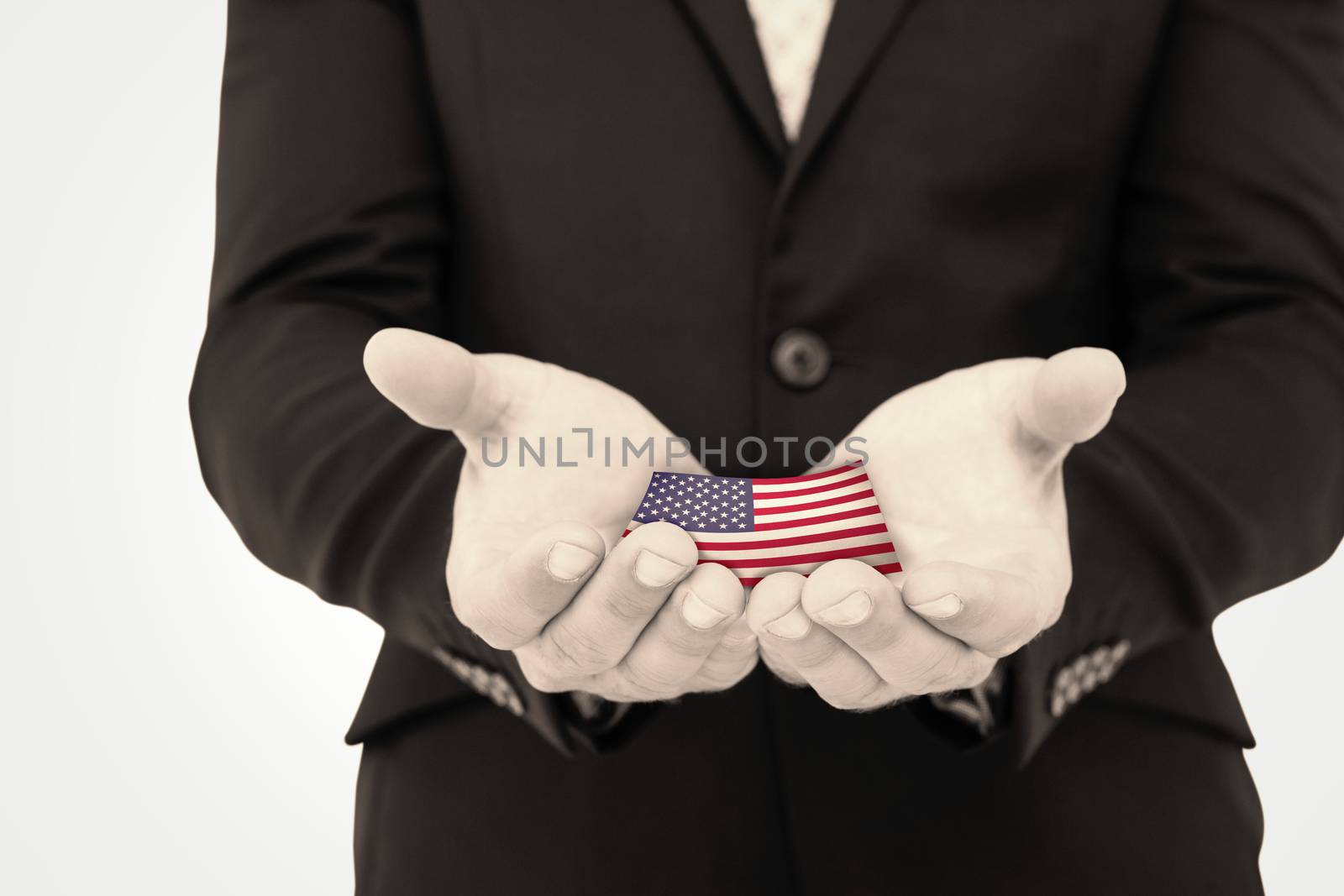 Businessman holding his hands out against usa national flag