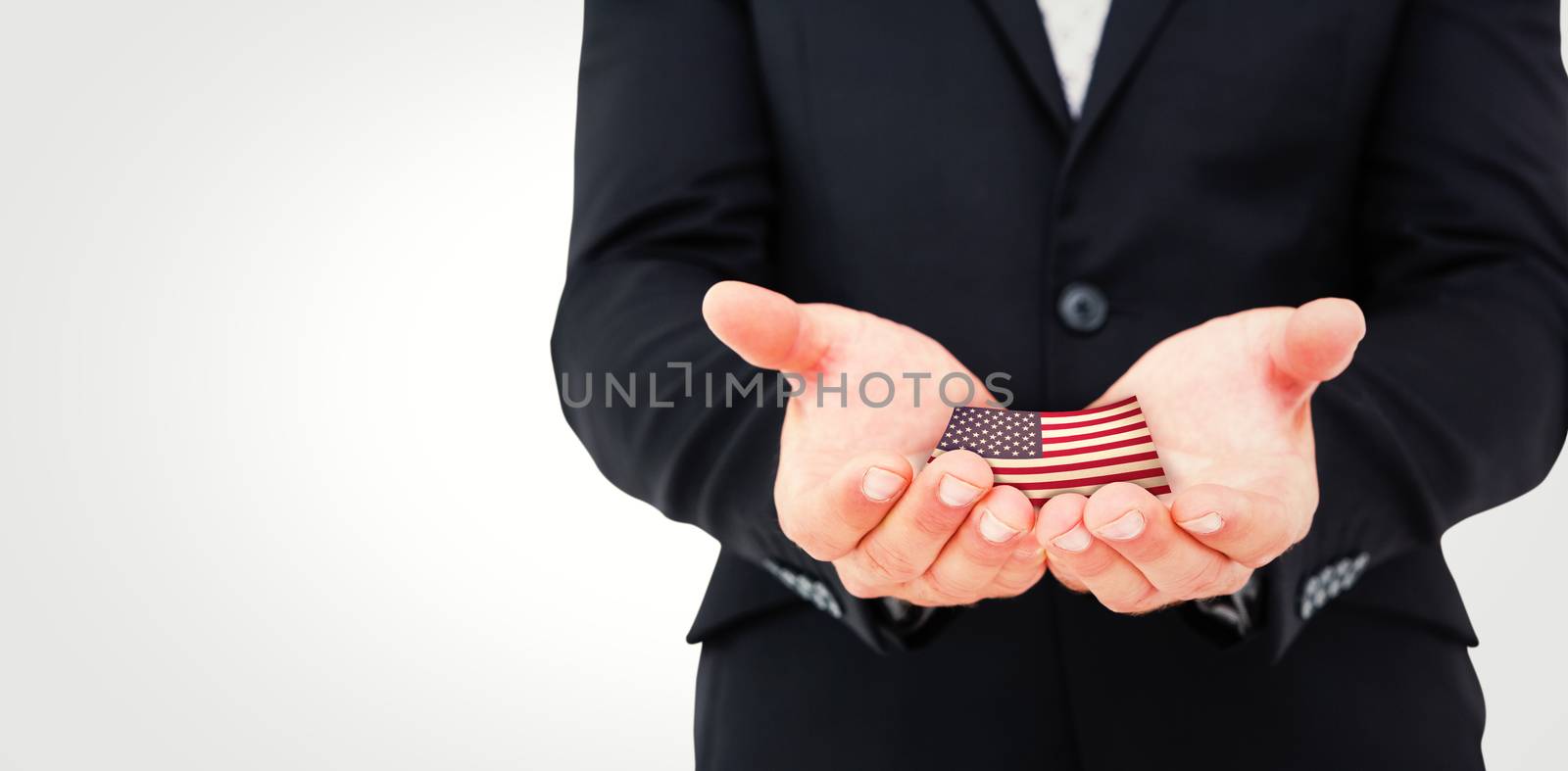 Businessman holding his hands out against usa national flag