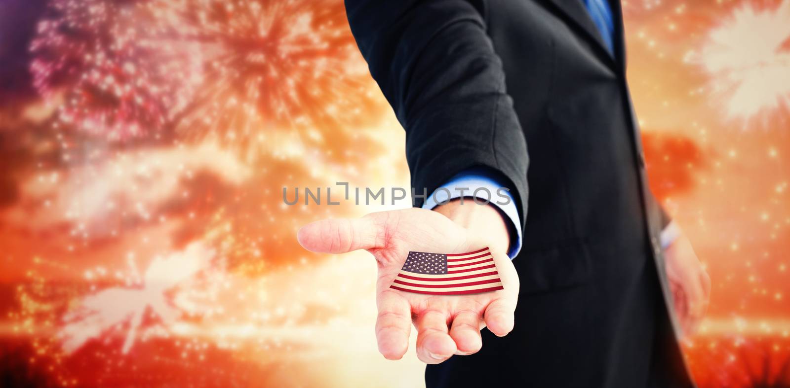 Composite image of businessman holding out his hands to the camera by Wavebreakmedia