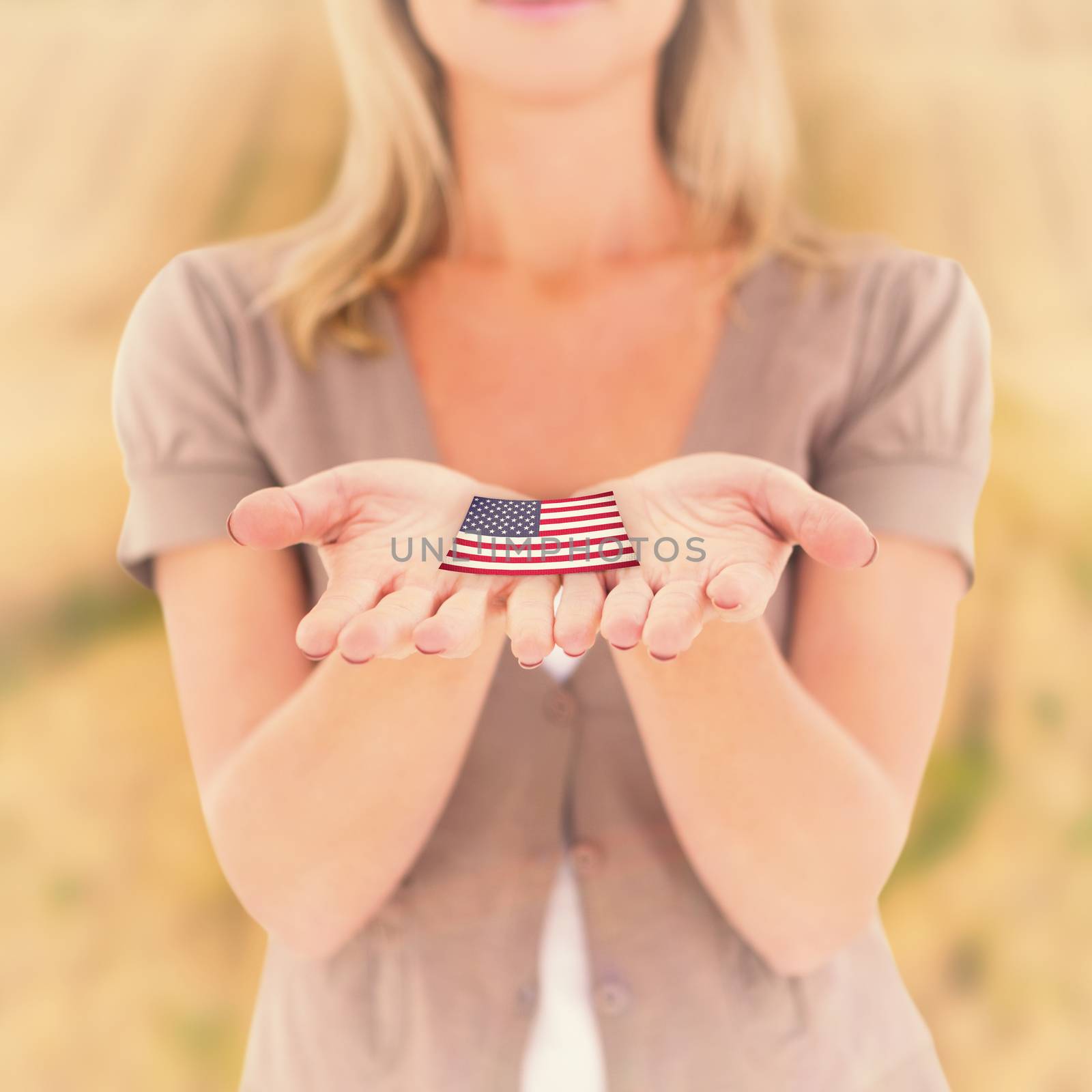 Happy blonde holding our her hands against rural fields