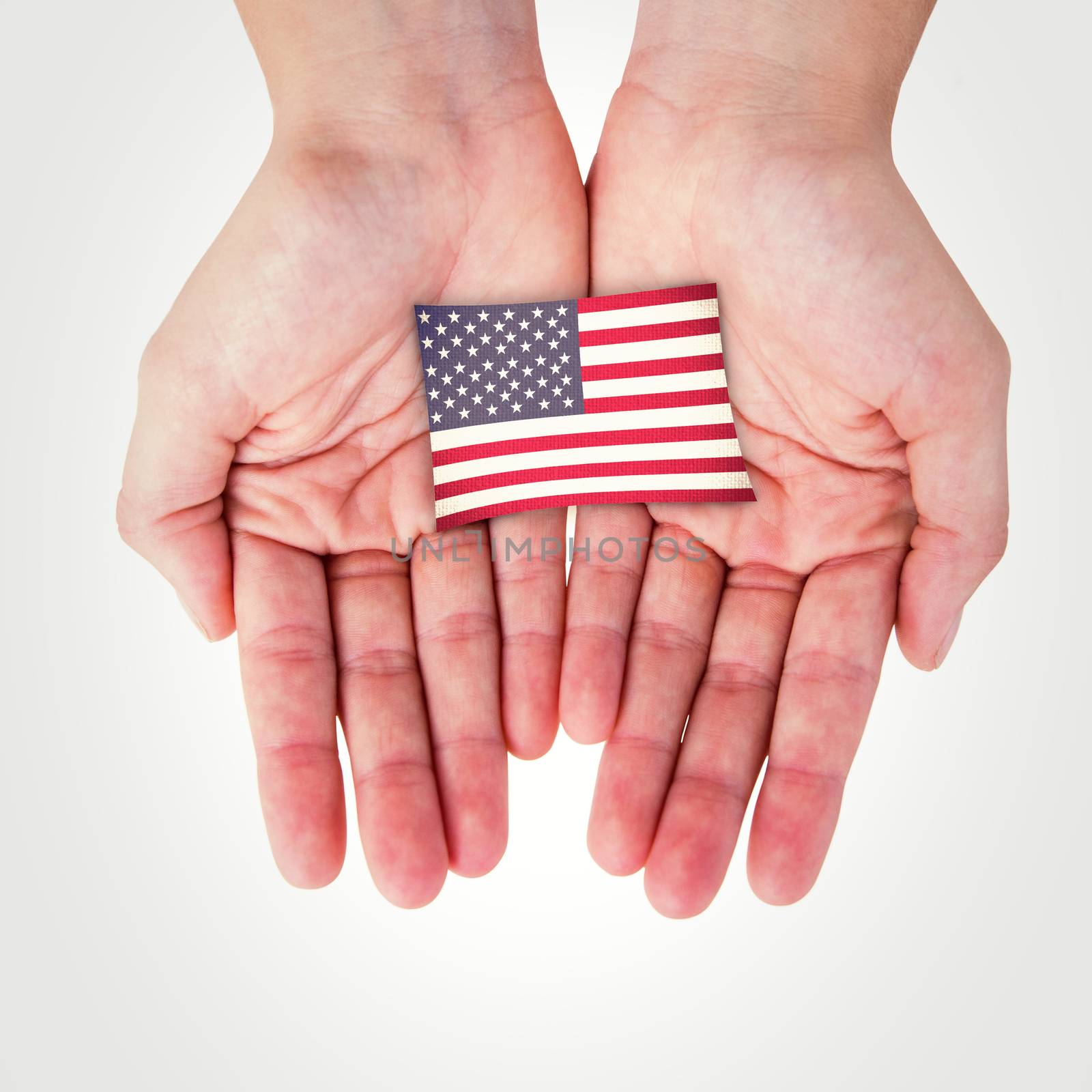 Hands showing against usa national flag