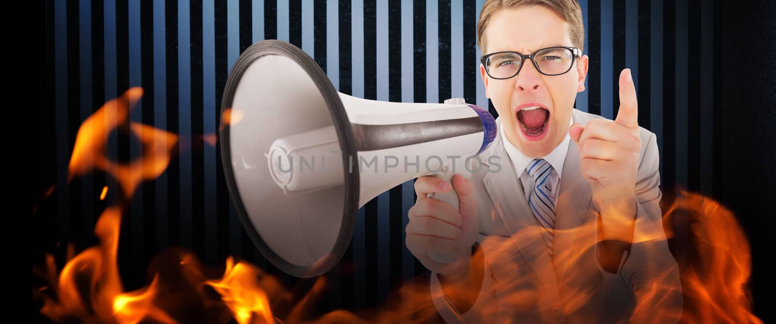 Geeky businessman shouting through megaphone against dark grey room