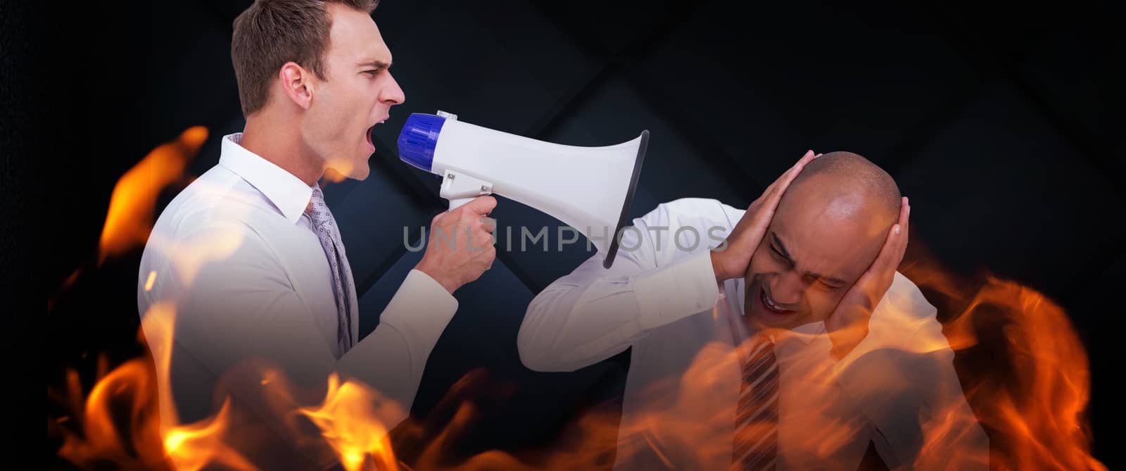 Businessman yelling with a megaphone at his colleague against dark grey room