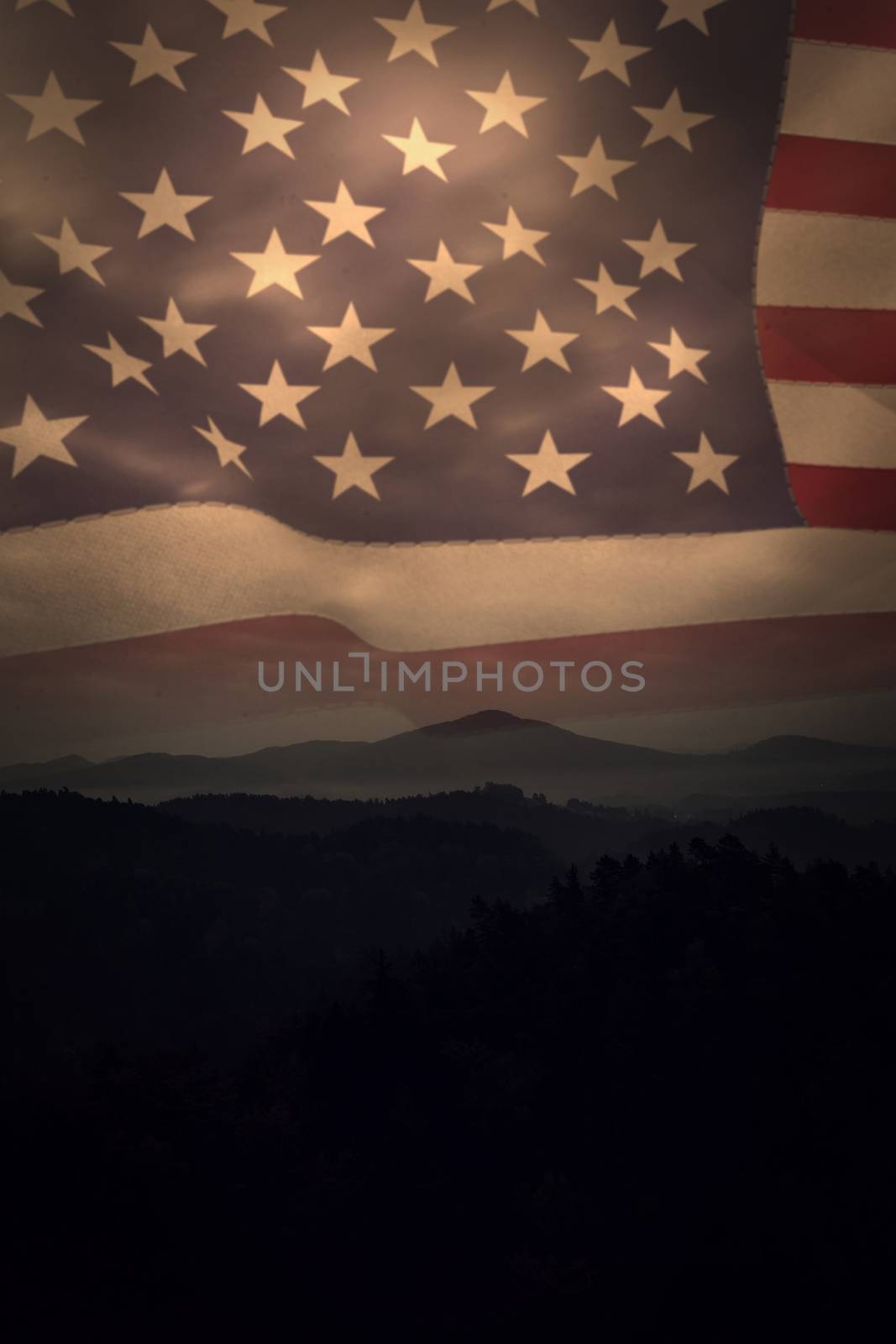 United states of america flag against trees and mountain range against cloudscape