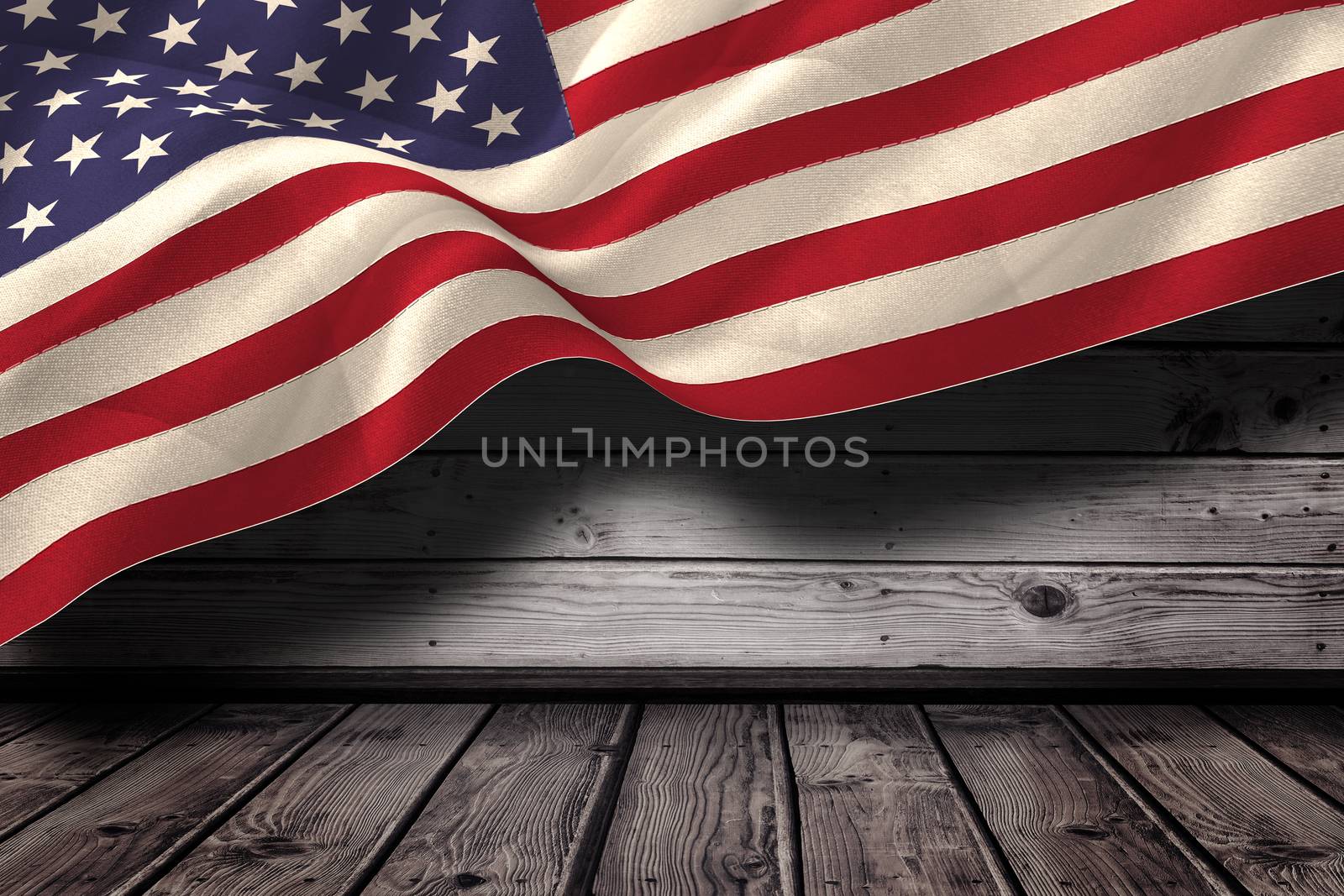 Digitally generated united states national flag against dark wooden room