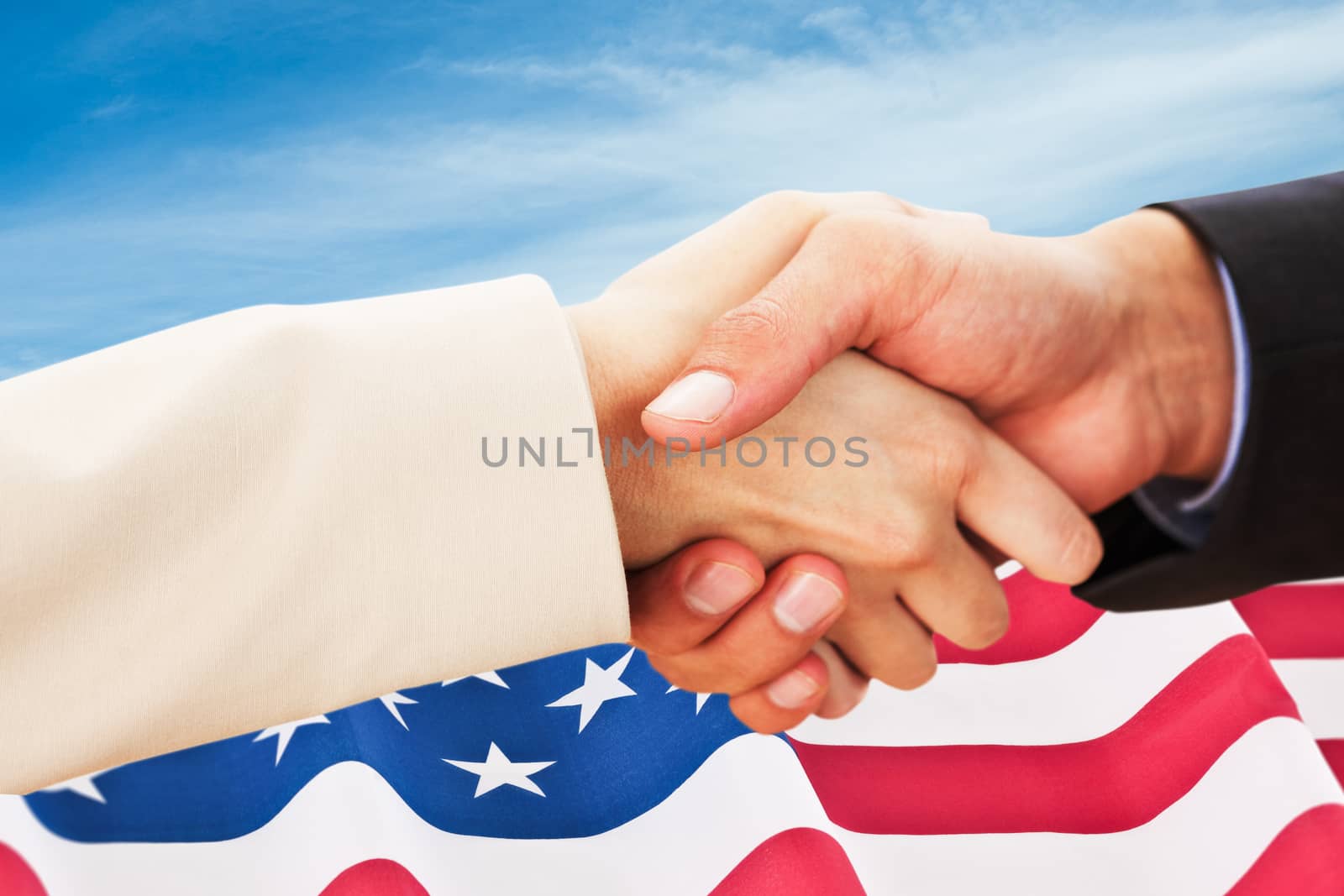 Composite image of close up on partners shaking hands by Wavebreakmedia