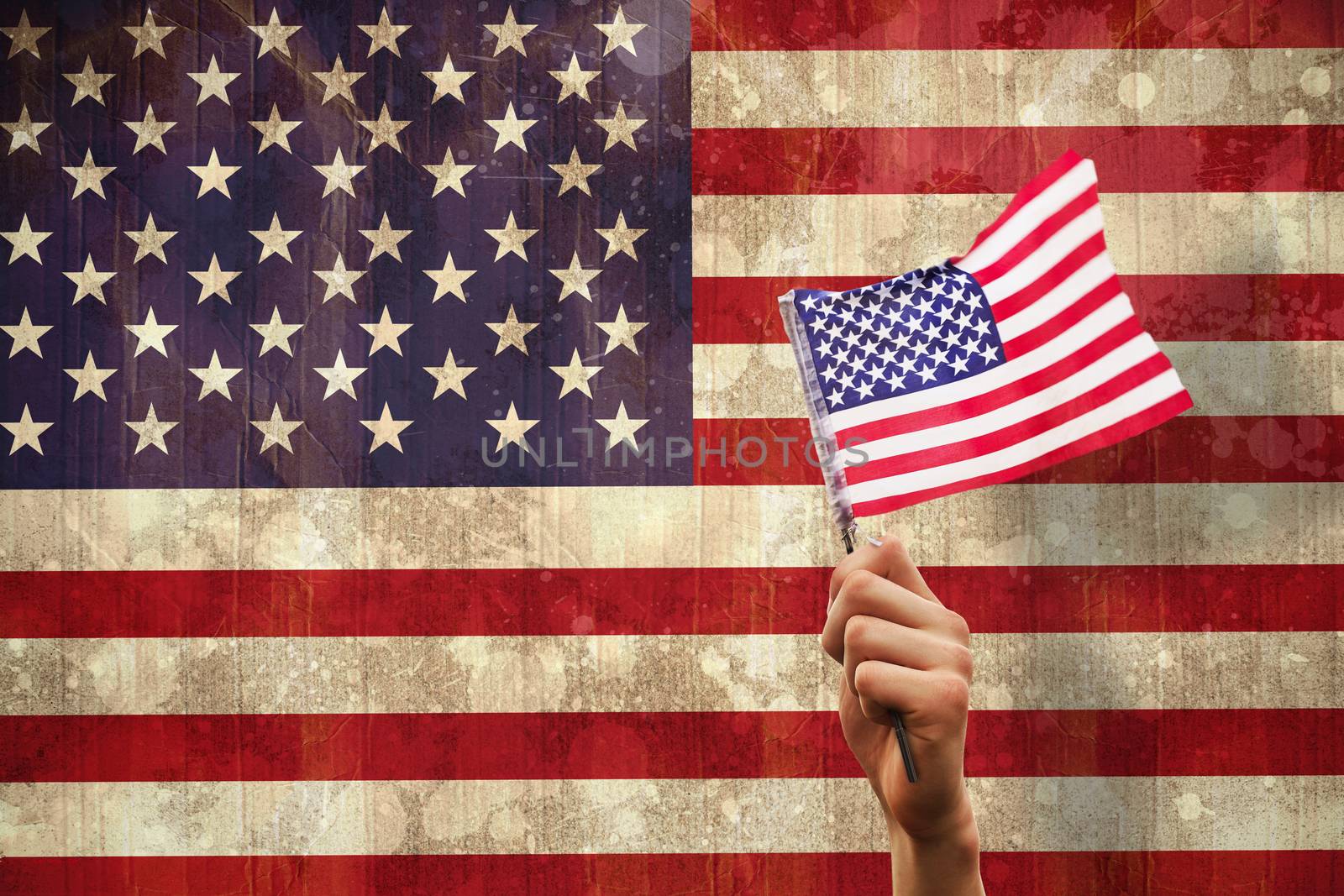Hand waving american flag against usa flag in grunge effect