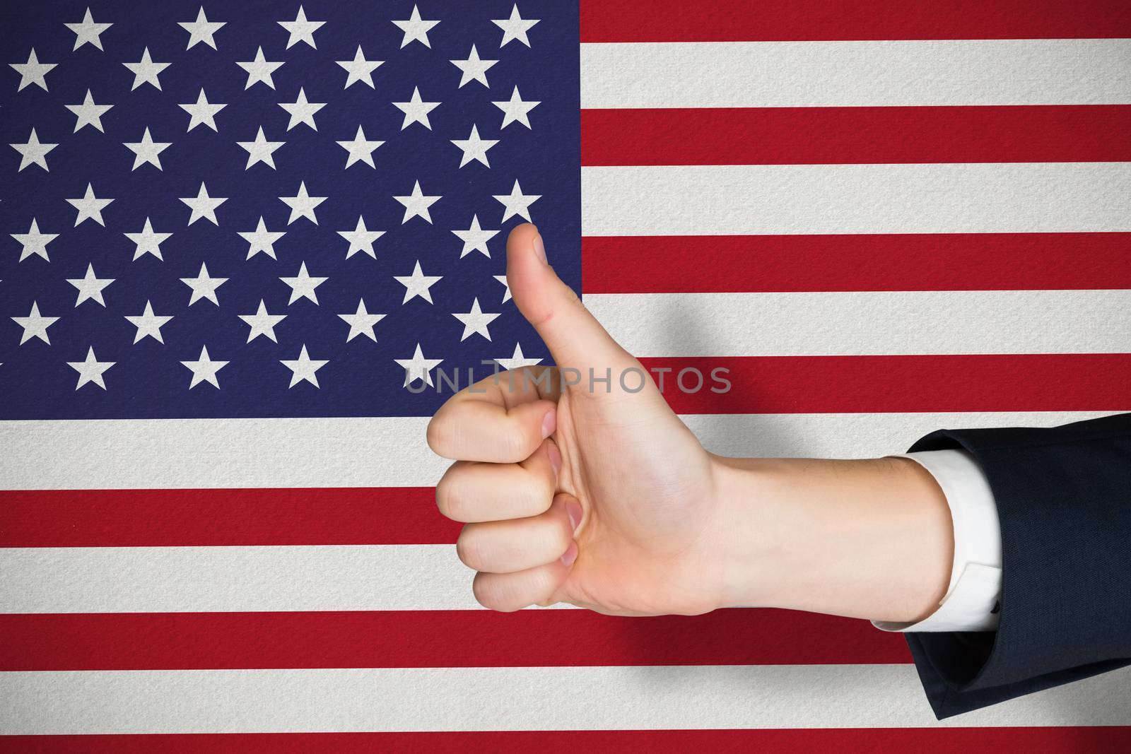 Hand showing thumbs up against digitally generated grey background