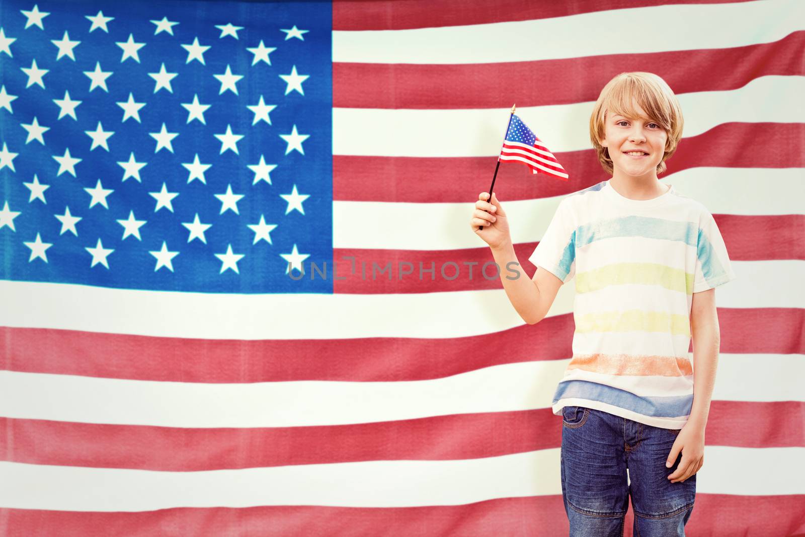 Cute boy with american flag against rippled us flag