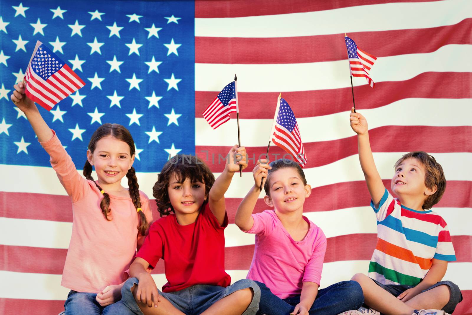 Children with american flags against rippled us flag
