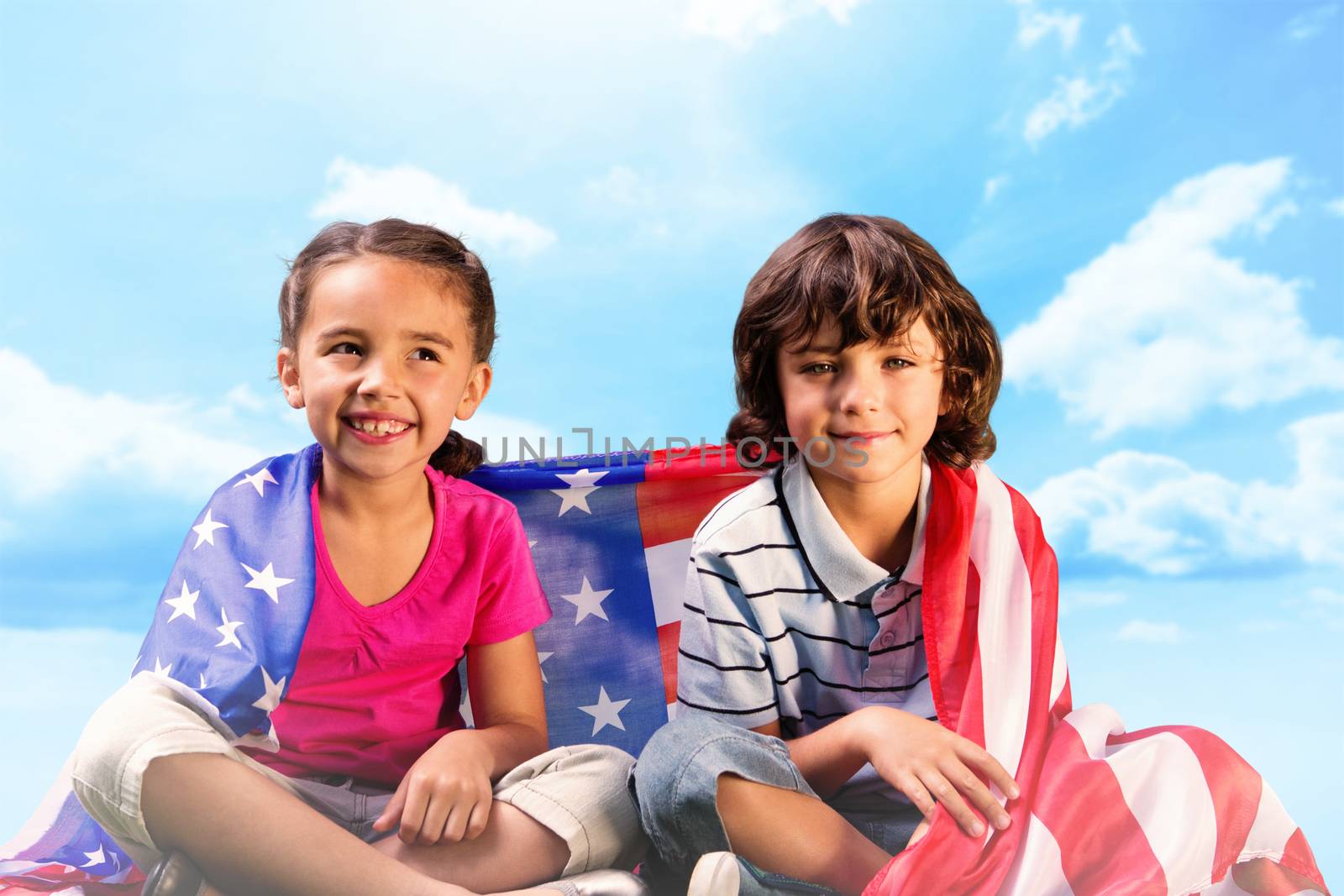 Children with american flag against blue sky