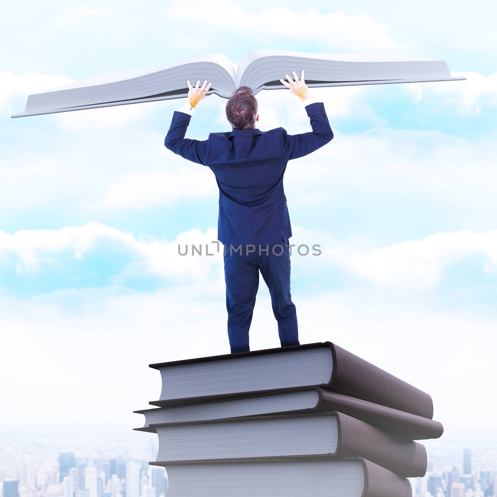 Composite image of businessman climbing on a cube with arms out by Wavebreakmedia