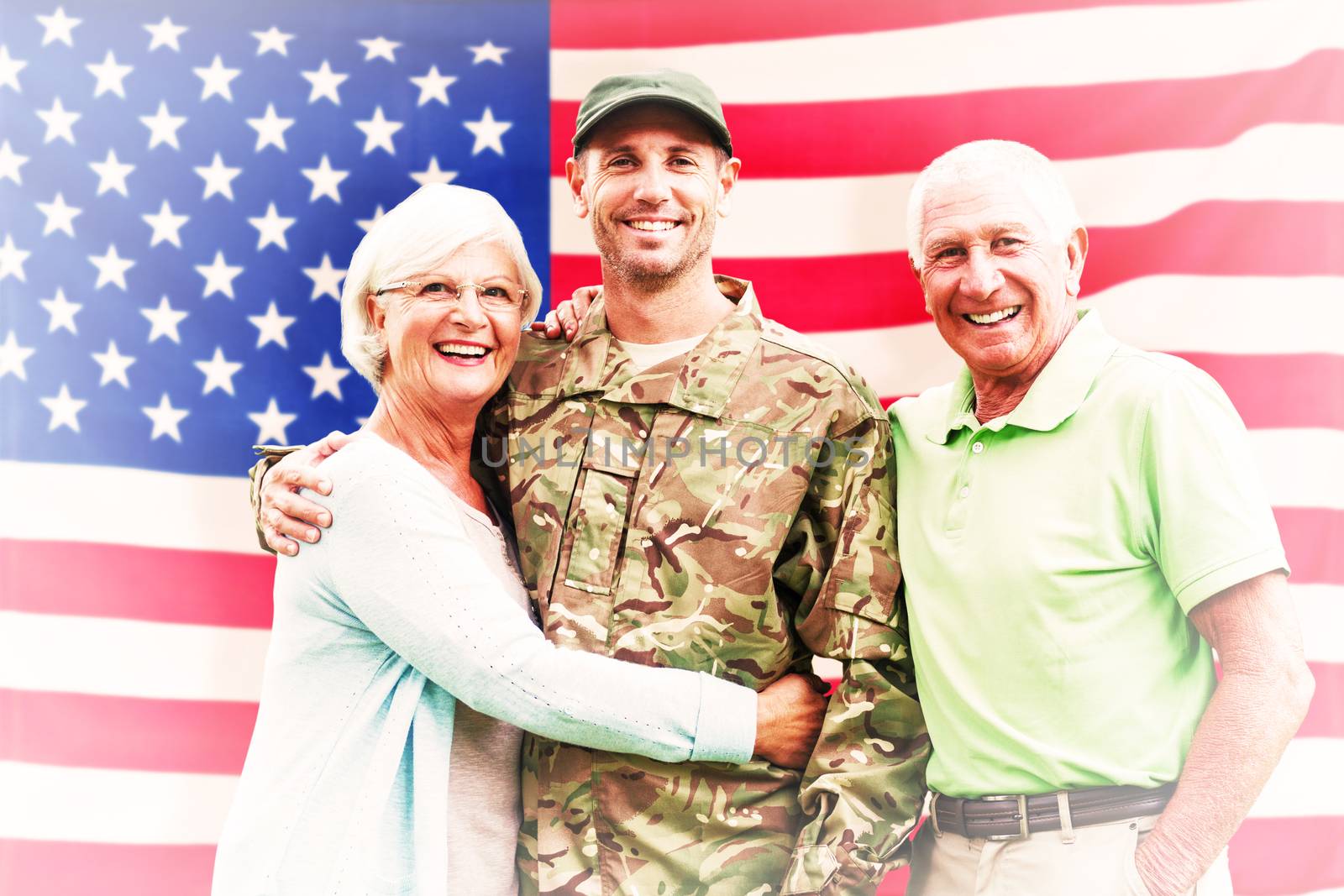 Soldier reunited with parents against rippled us flag