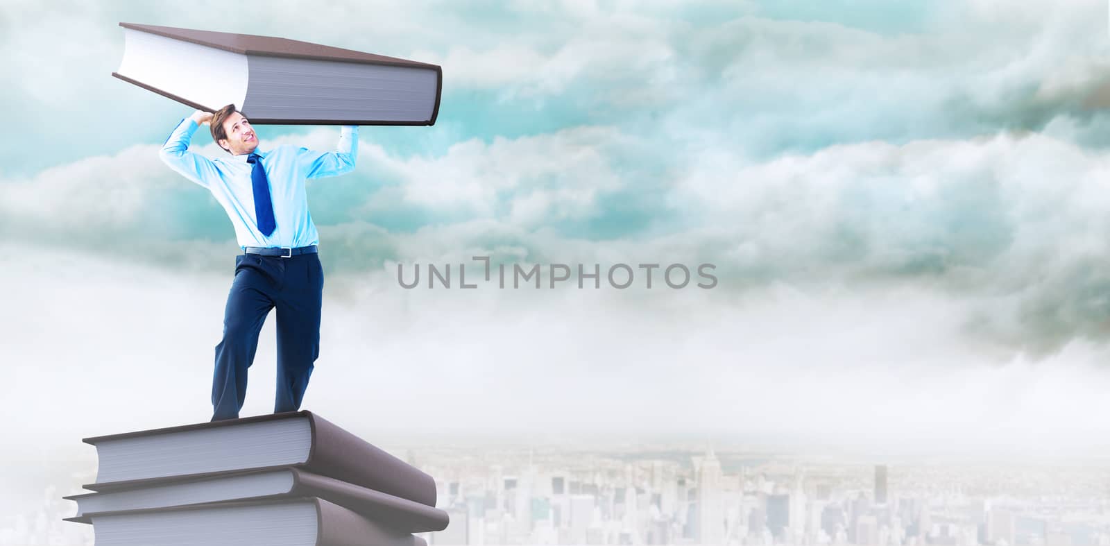 Focused businessman lifting up something heavy against cityscape on the horizon
