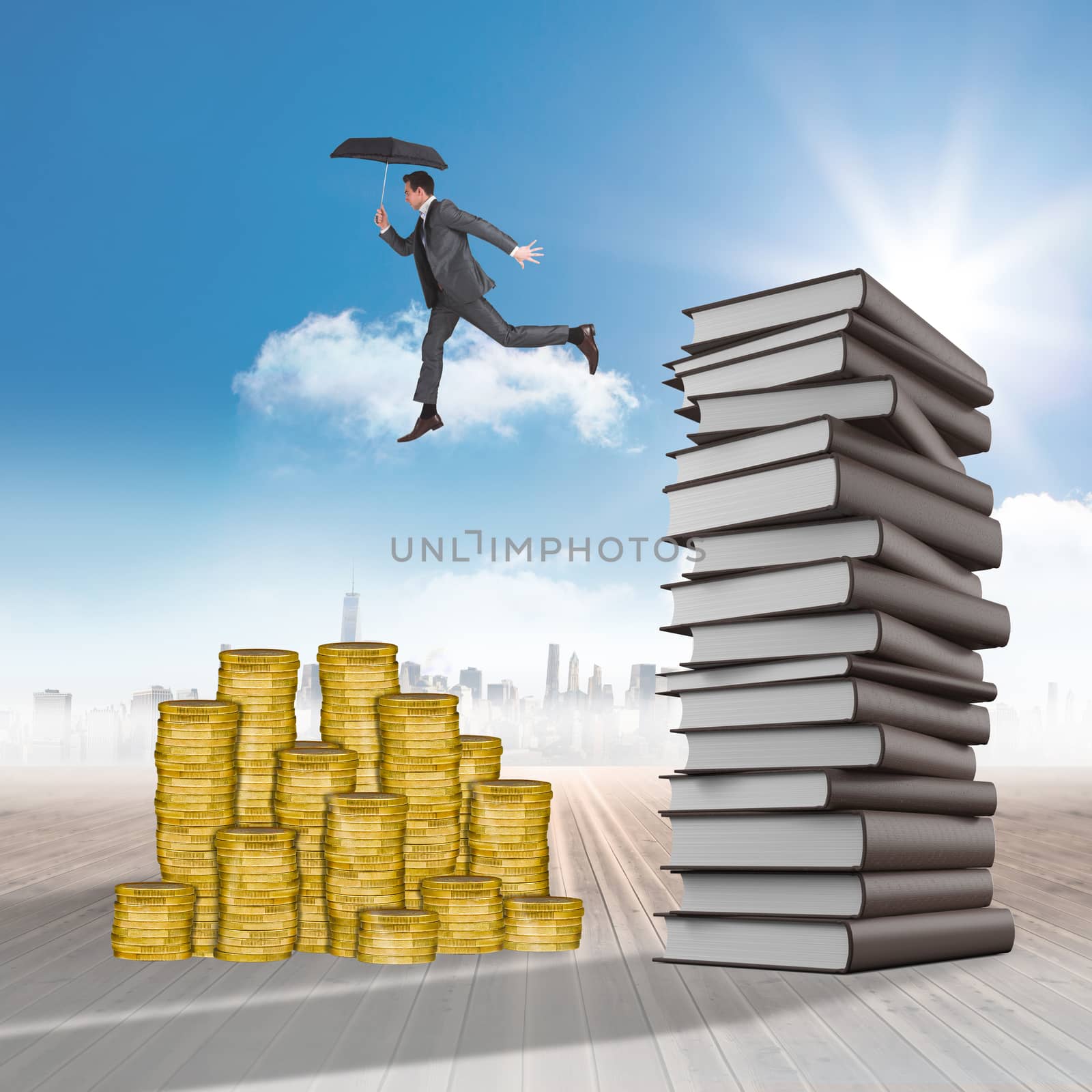 Businessman jumping holding an umbrella against cityscape on the horizon