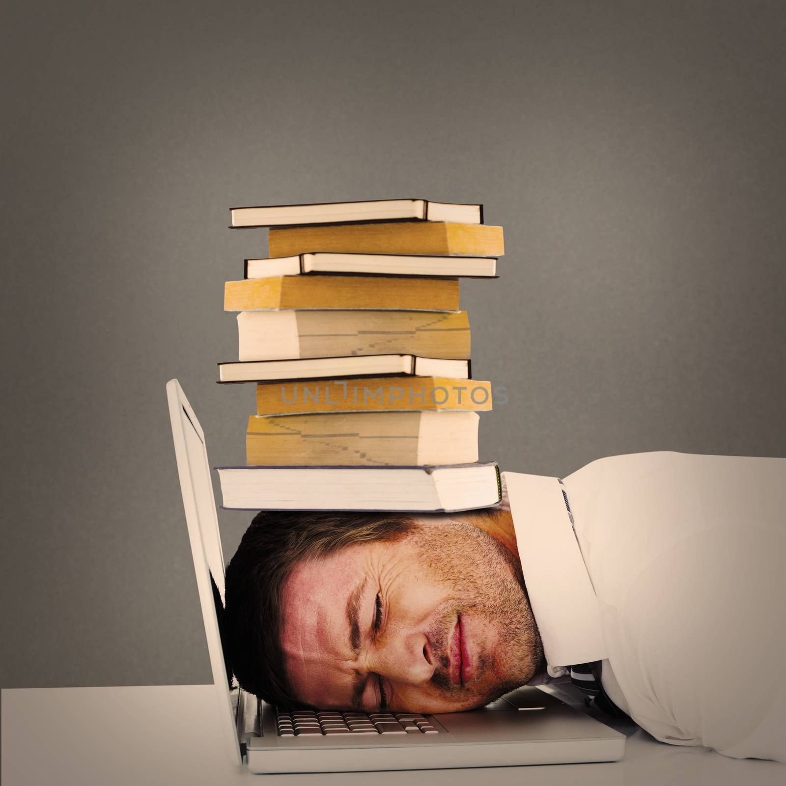 Composite image of tired businessman resting on laptop by Wavebreakmedia