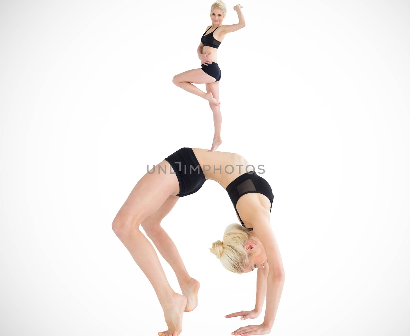 Composite image of side view of a fit young woman doing the wheel pose
