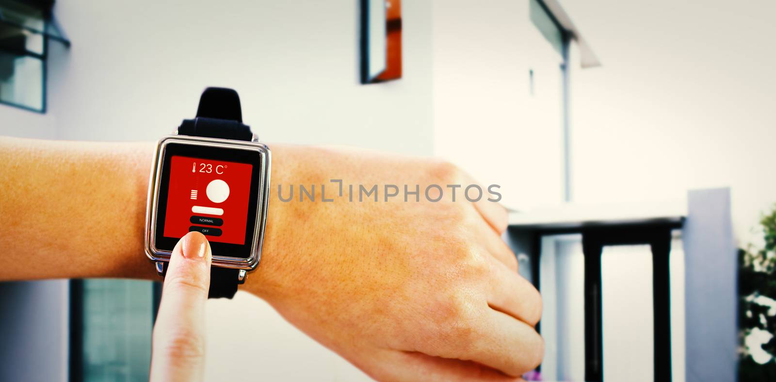 Composite image of smartwatch on wrist by Wavebreakmedia