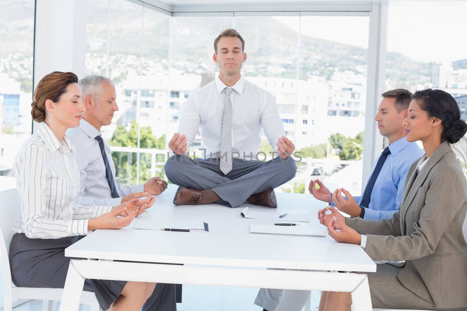 Business team relaxing eyes closed in the office