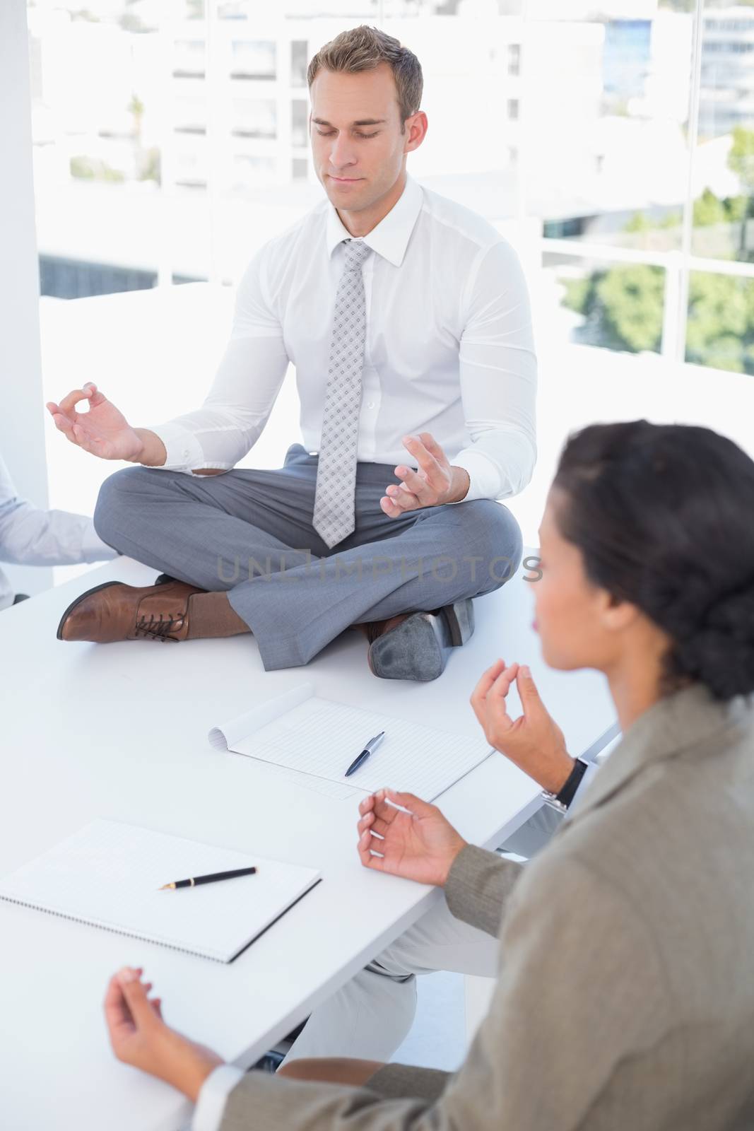 Business team relaxing eyes closed in the office