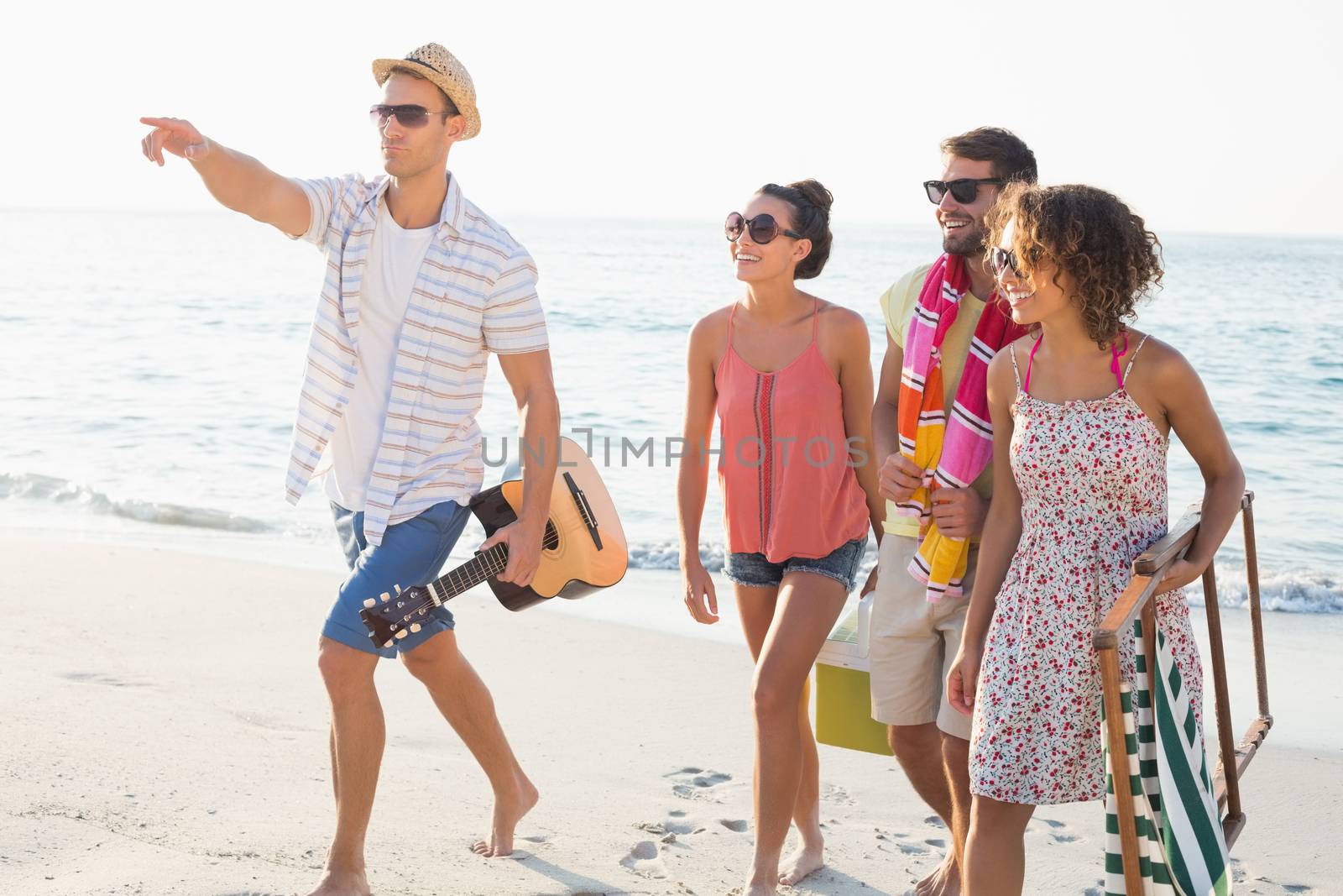 group of friends having fun at the beach