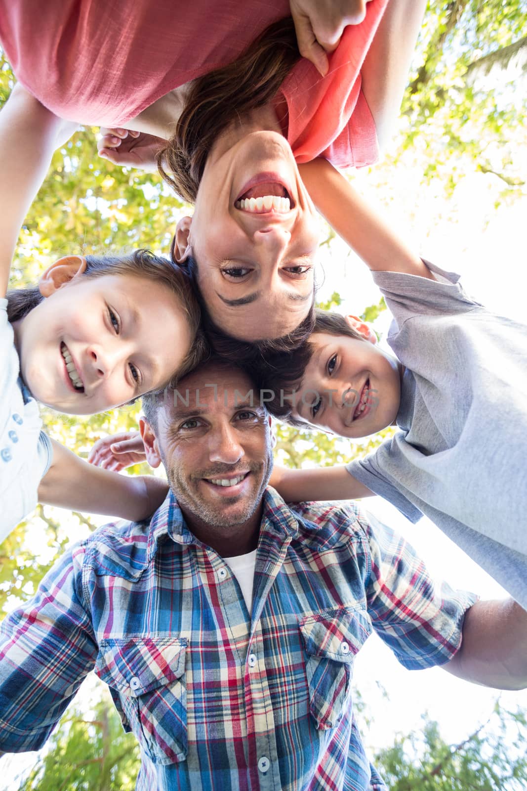 Happy family in the park together on a sunny day