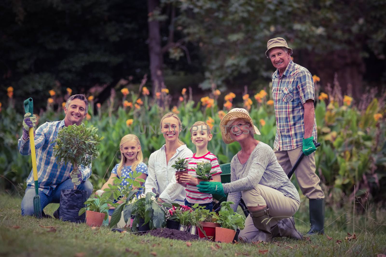 Happy family gardening  by Wavebreakmedia