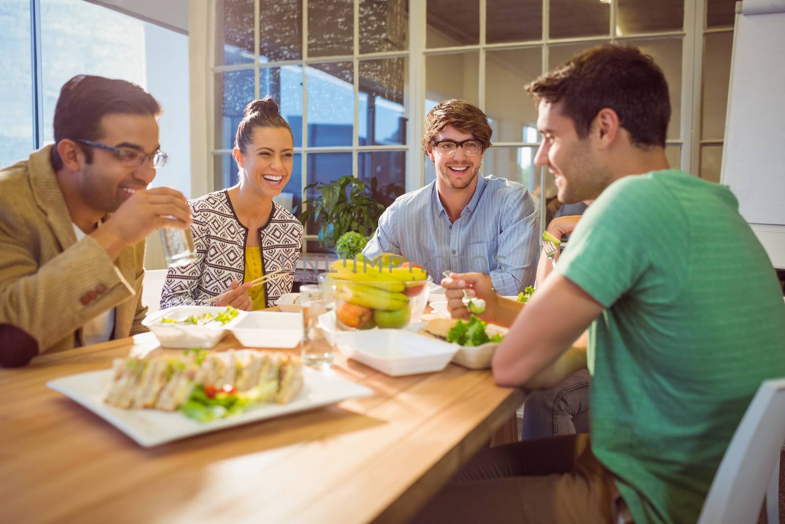 Young business people having lunch together