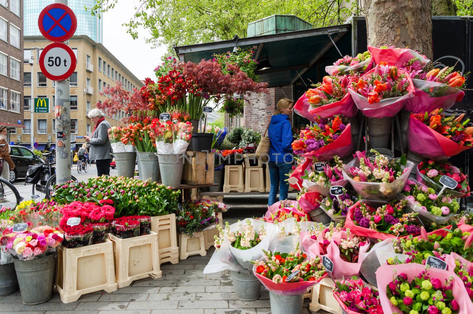 Rotterdam, Netherlands - May 9, 2015: People at Flower shop in Rotterdam by siraanamwong