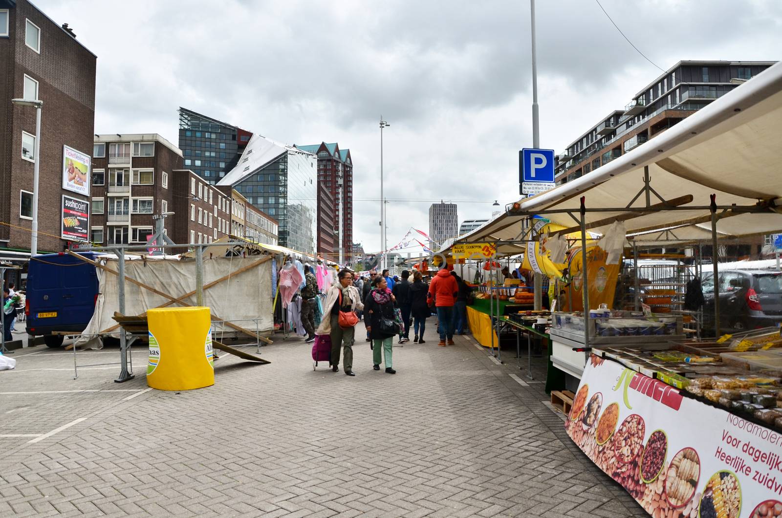 Rotterdam, Netherlands - May 9, 2015: Unidentified shoppers at the Street Market in Rotterdam. by siraanamwong