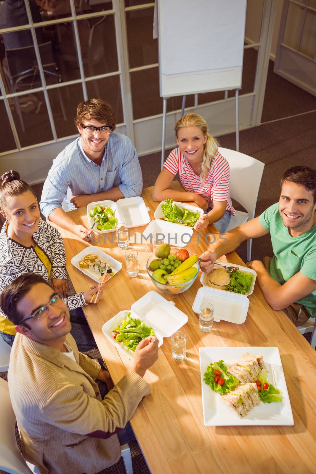 Young business people having lunch together